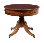 A mahogany library drum table