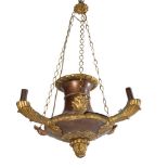 A gilt metal and coppered three branch ceiling light in Empire style