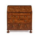 A George II walnut and feather banded bureau