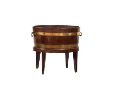 A George III mahogany and brass bound wine cooler or jardinière