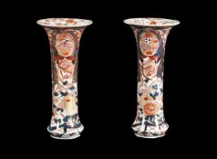 A pair of Japanese Imari trumpet vases
