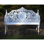 A white painted cast iron bench