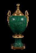A simulated malachite porcelain and gilt metal mounted urn or centre piece