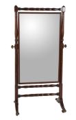 A Regency mahogany and ebonised strung cheval mirror