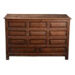 A George III panelled oak chest