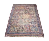 A Persian Lavar Kirman carpet
