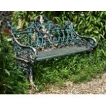 A green painted cast iron bench in the Coalbrookdale 'Gothic' pattern