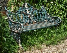 A green painted cast iron bench in the Coalbrookdale 'Gothic' pattern