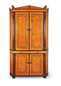 An Amboyna and ebonised cabinet in Regency style