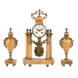 A French Siena marble and gilt brass mounted mantel clock garniture