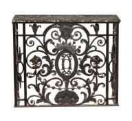 A wrought iron and marble topped side table