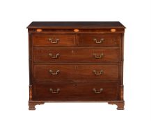 A mahogany and inlaid chest of drawers