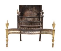 A George III brass and cast iron fire grate in neo-classical style