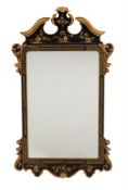 A modern Italian giltwood and black lacquered wall mirror in early 18th century style