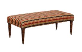 A mahogany and upholstered centre stool in Regency style