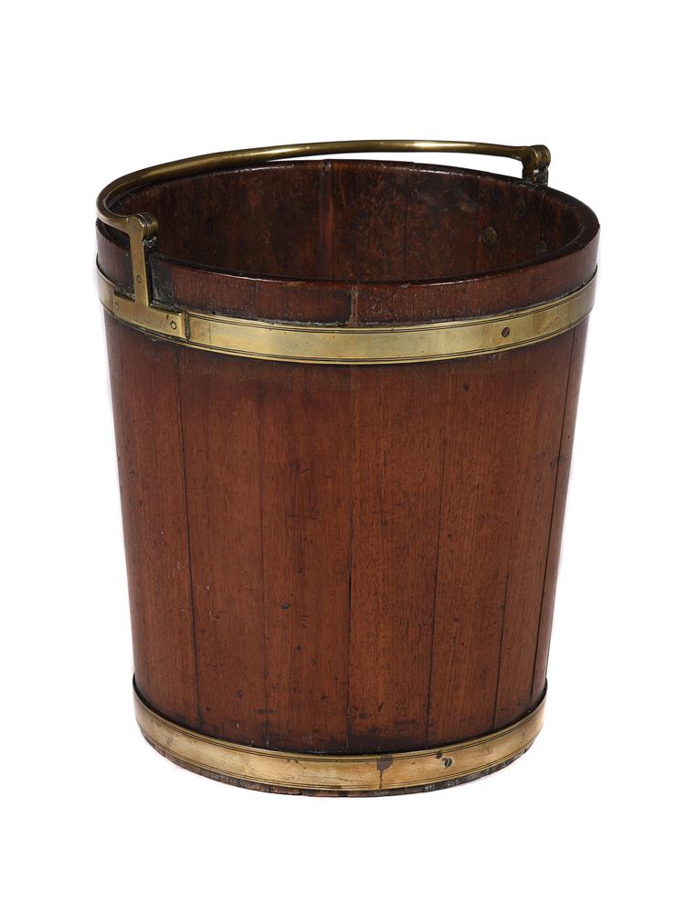 A George III mahogany and brass bound peat bucket