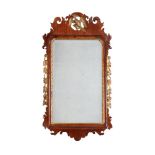 A George III walnut and parcel gilt mirror