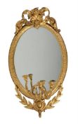 A pair of Victorian giltwood and composition girandole oval wall mirrors with three candle branches