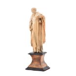 Y A carved ivory model of a saint