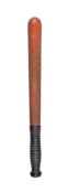 A mid Victorian red and black painted wood truncheon