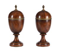 A pair of carved wood and gilt metal mounted urns and covers in George III style