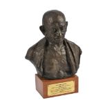 A bronzed portrait bust of Mohandas Gandhi