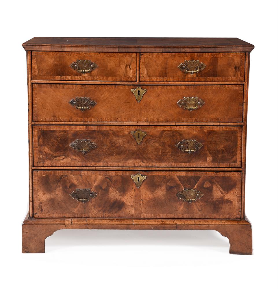 A George II walnut and ash crossbanded chest of drawers