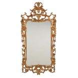 A carved giltwood wall mirror in George II style