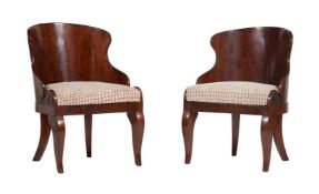 A pair of mahogany armchairs in Empire style