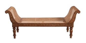 An Indian hardwood, bone inlaid and caned window seat or day-bed