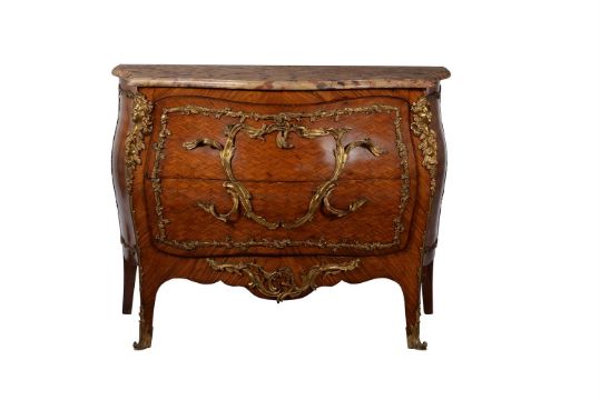 A French parquetry and gilt metal mounted bombe commode in Louis XV style