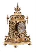 A gilt metal mantel clock