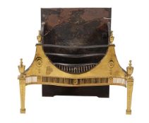 A George III brass and cast iron fire grate in neo-classical style