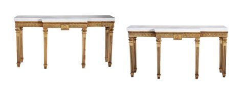 A pair of mahogany and parcel gilt console tables in George III style