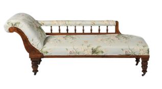 A Victorian walnut and oak chaise longue