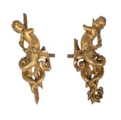 A pair of carved giltwood mounts