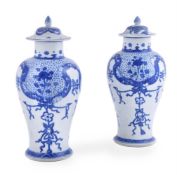 A pair of Chinese 'Shipwreck' blue and white vases and covers