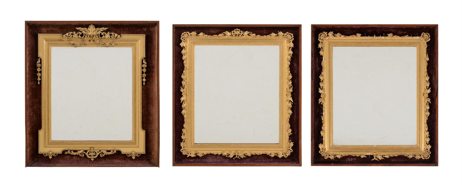 Y A pair of rosewood, velvet, giltwood and composition wall mirrors