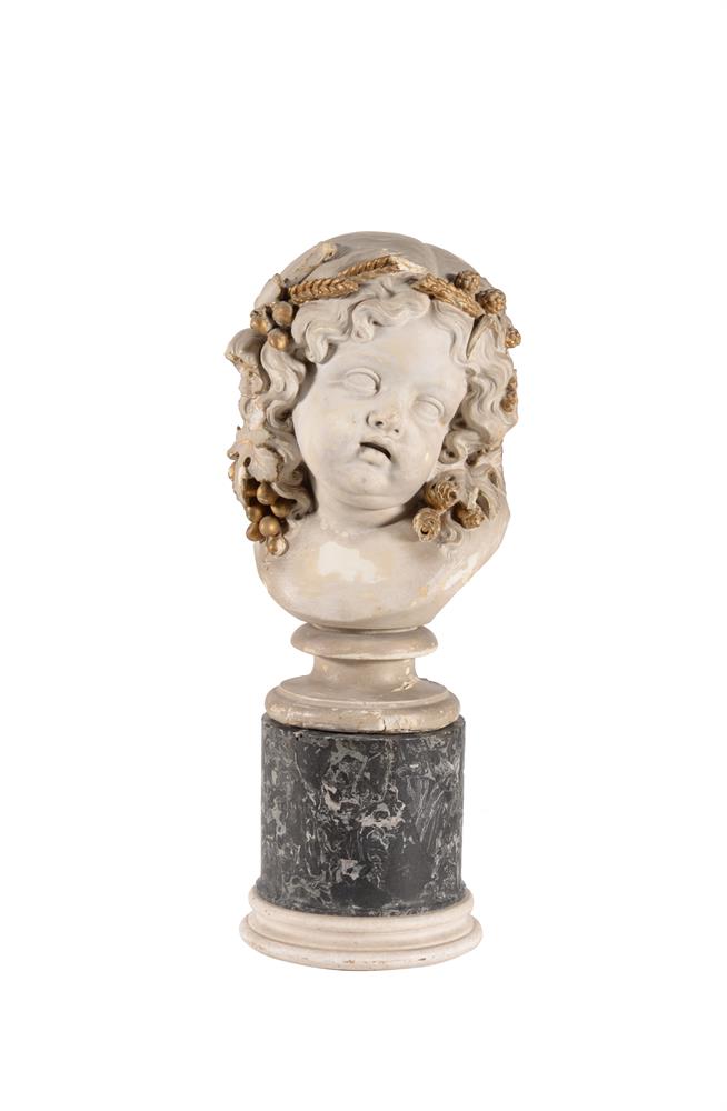 An Italian plaster bust of a cherub