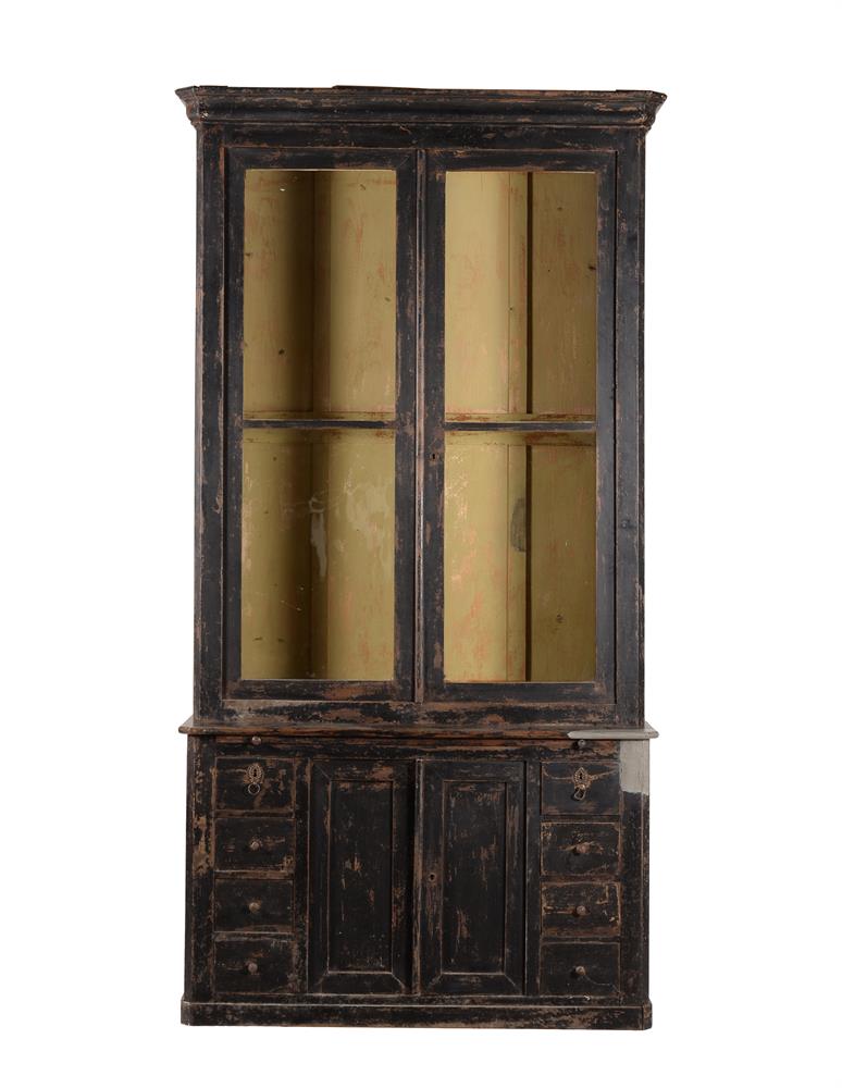 A Continental ebonised bookcase cabinet