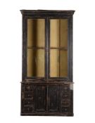 A Continental ebonised bookcase cabinet