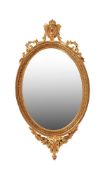 A Victorian giltwood and composition oval mirror