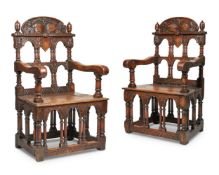 A pair of carved 'throne' armchairs