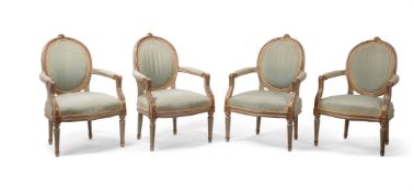 A set of four French grey painted and parcel gilt fauteuils