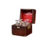 A Victorian mahogany and brass bound campaign four decanter spirit set