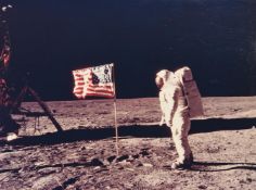 Buzz Aldrin beside the flag, his face visible in the visor [large format], Apollo 11,16-24 Jul 1969