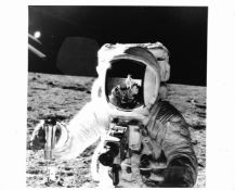 The celebrated 'visor' portrait of Alan Bean with lunar soil samples, Apollo 12, 14-24 Nov 1969