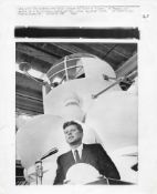 President John F. Kennedy with a scale model of the Apollo command module, Sept 1962