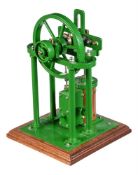 A well-engineered model of an over-type vertical live steam cross engine