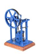 A well-engineered model of an over-type vertical live steam mill engine